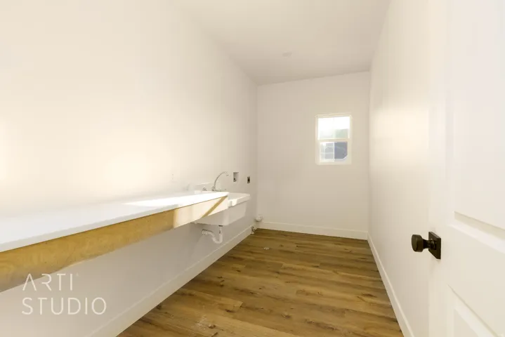 Bathroom featuring vanity and dark wood-style floors