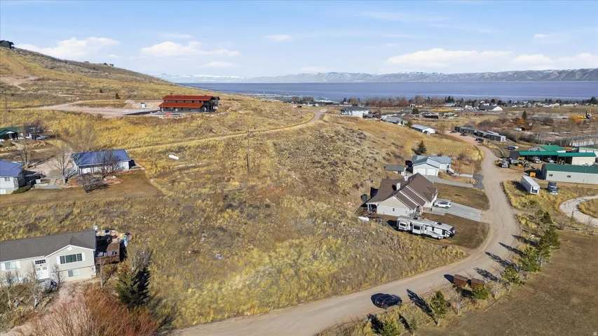 Aerial view of residential area featuring a mountainous background