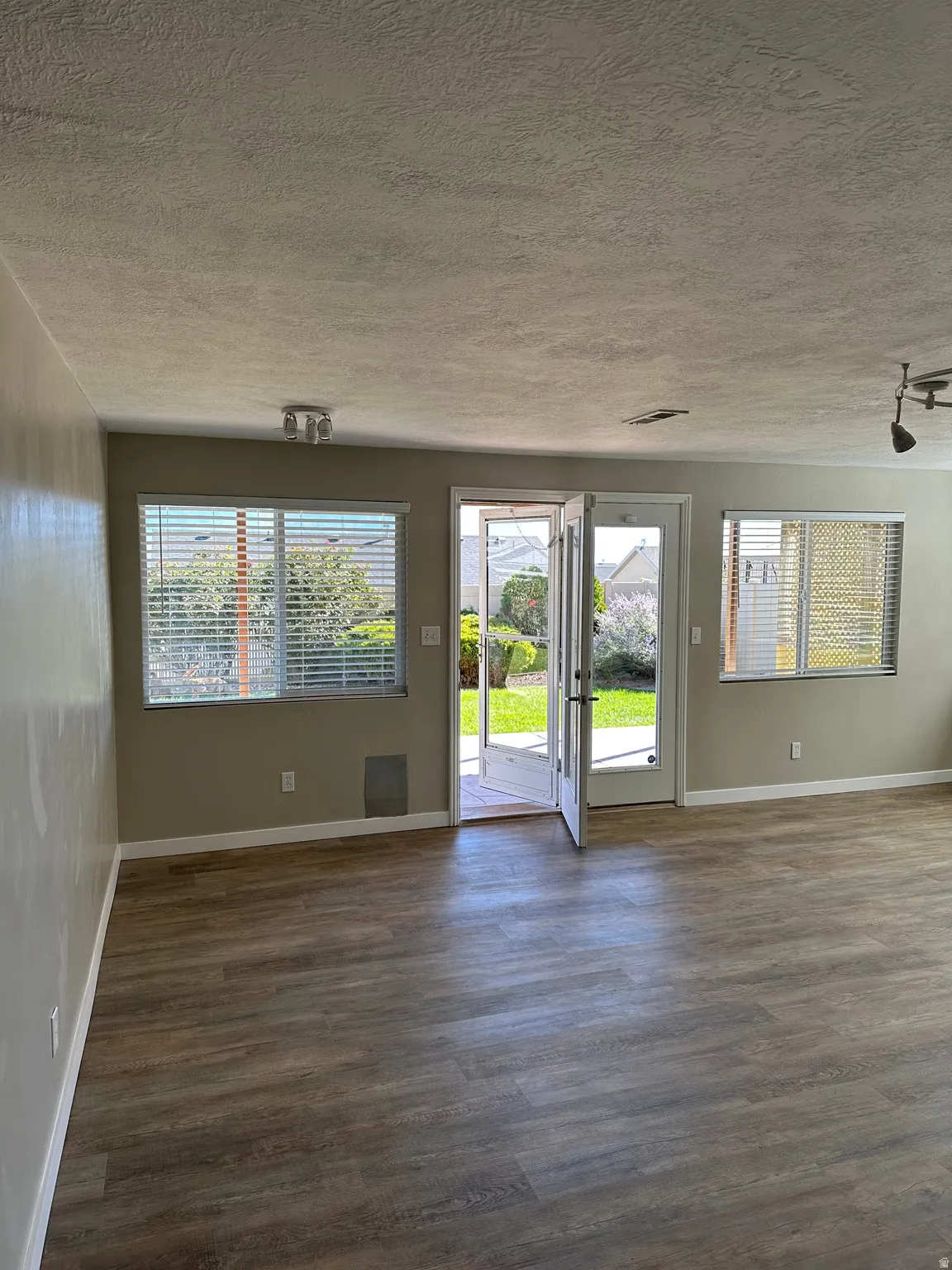 Finished basement exit to patio featuring plenty of natural light