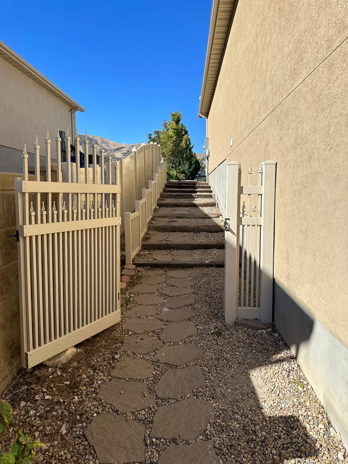 View of stairs to backyard and basement entrance
