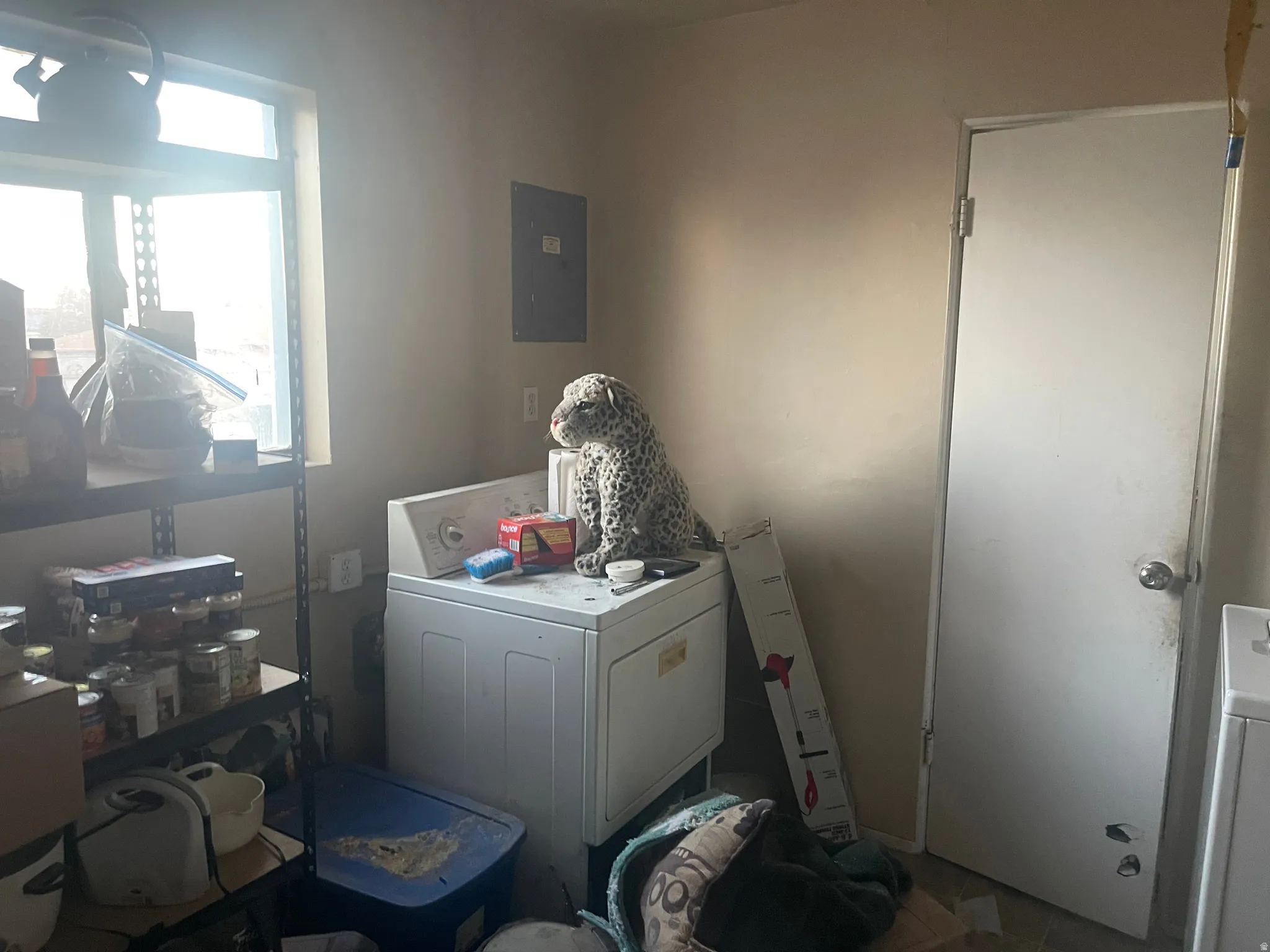 Laundry room featuring electric panel