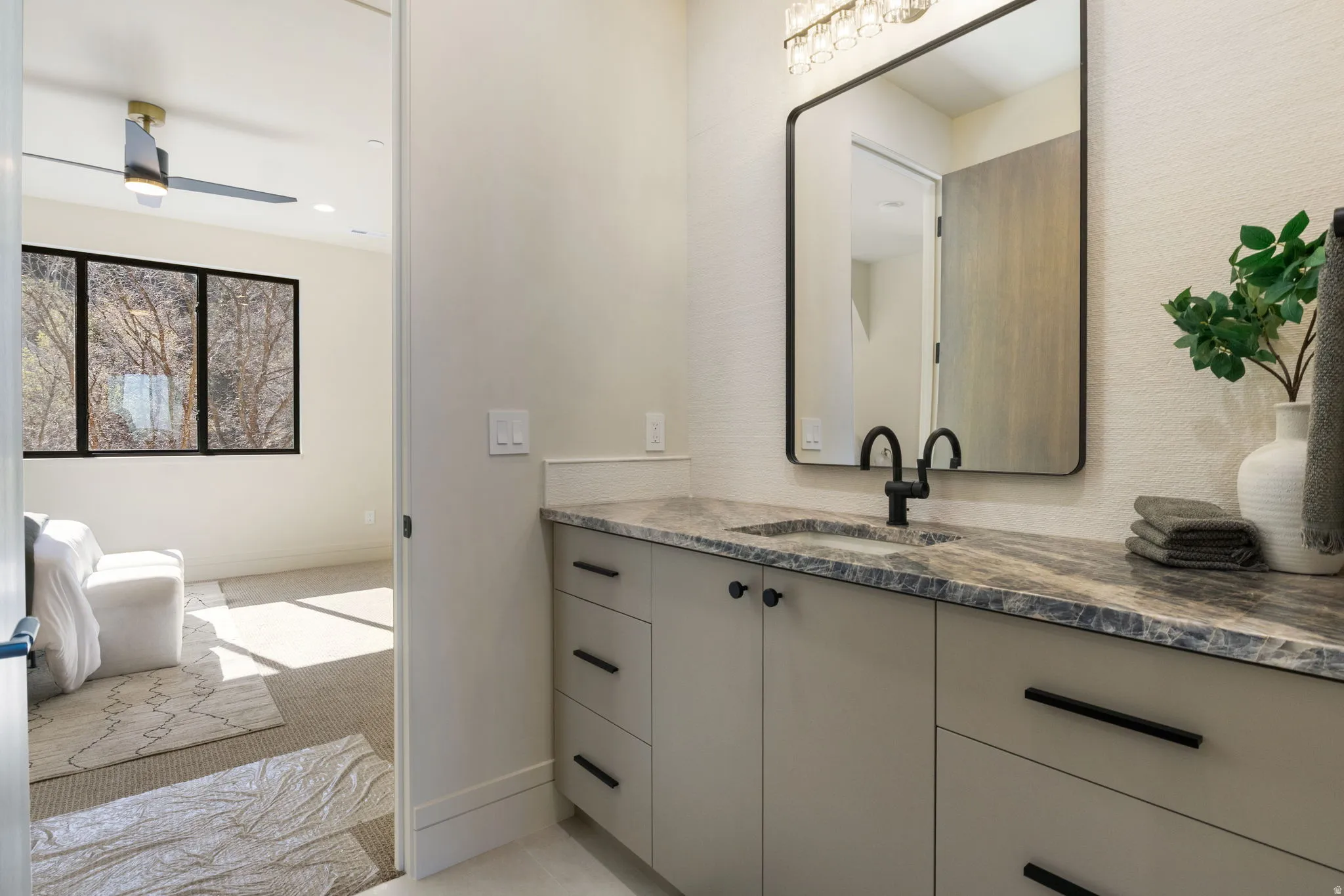 Bathroom featuring vanity, recessed lighting, and light carpet