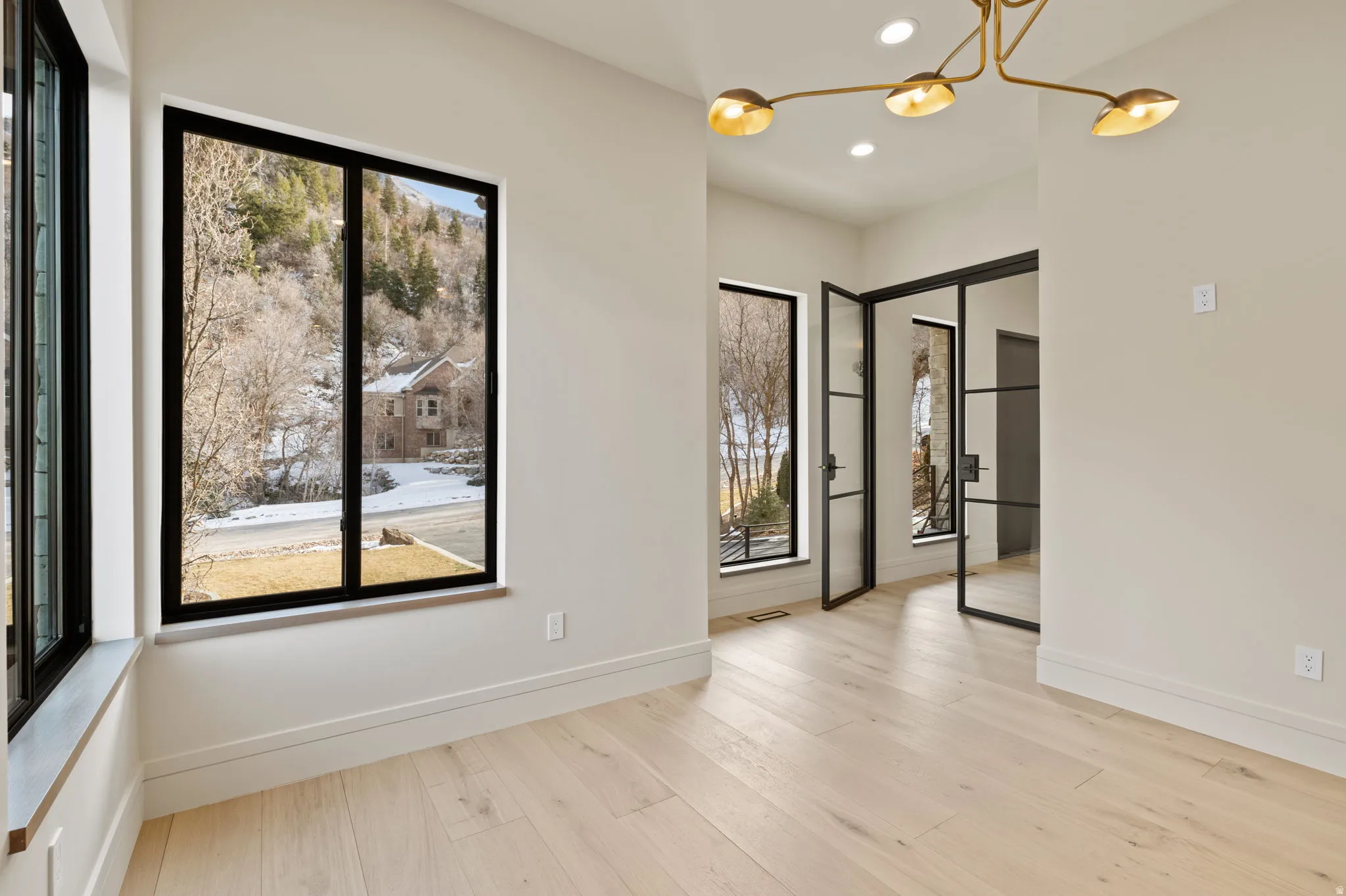 Office view featuring healthy amount of natural light, European White Oak floors and steel/glass French doors
