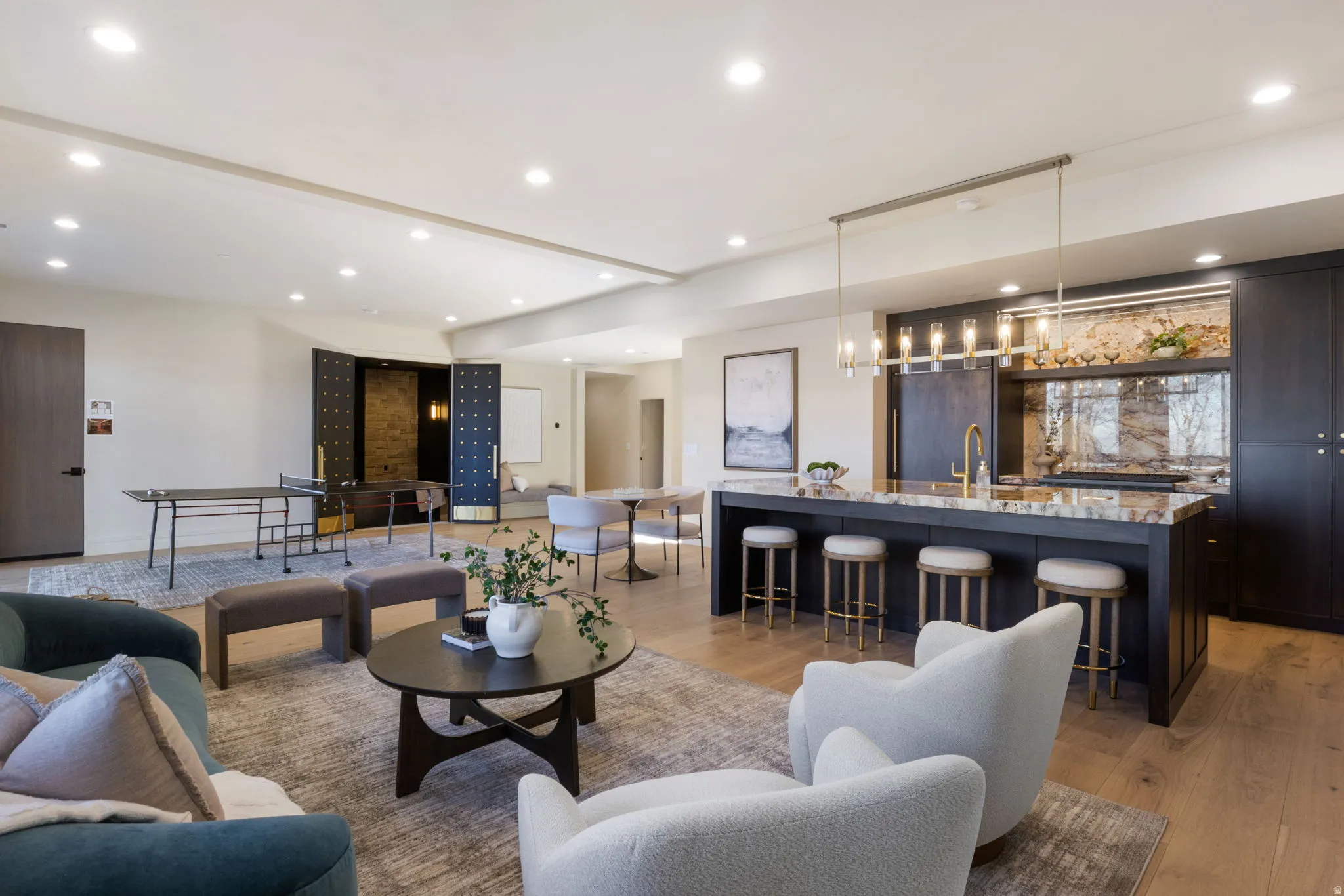 Living room featuring light wood-style flooring and recessed lighting