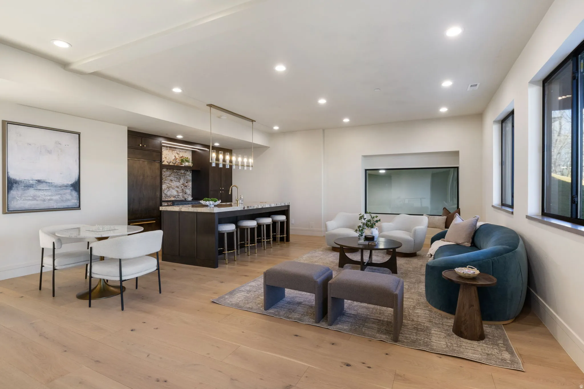 Living area featuring light wood-type flooring and recessed lighting