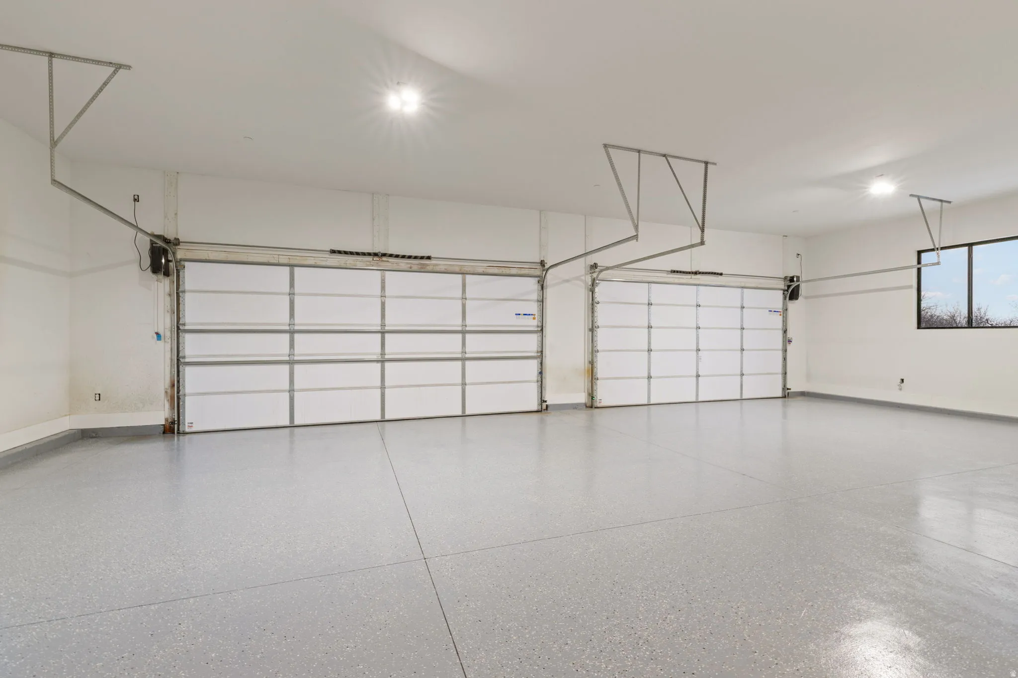 Garage featuring baseboards
