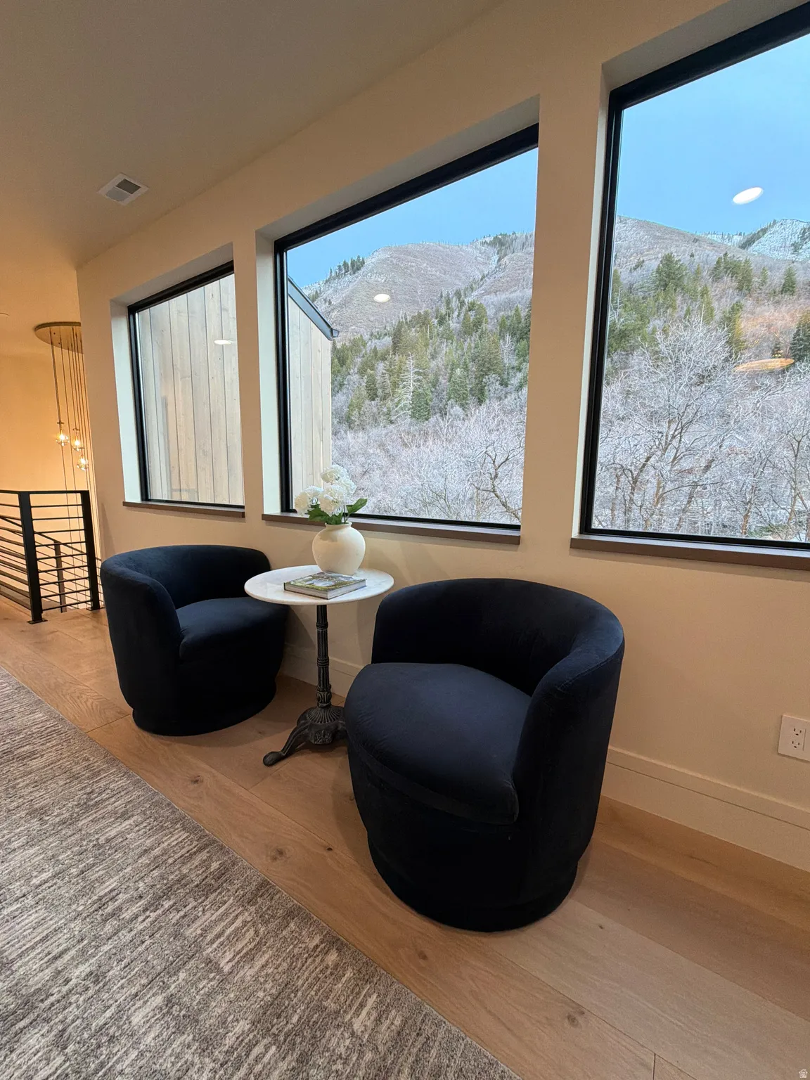 Living area with a mountain view and light wood finished floors