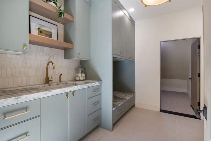 Kitchen featuring open shelves, gray cabinetry, backsplash, light tile patterned floors, and recessed lighting