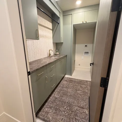 Bar area with baseboards and light tile patterned floors