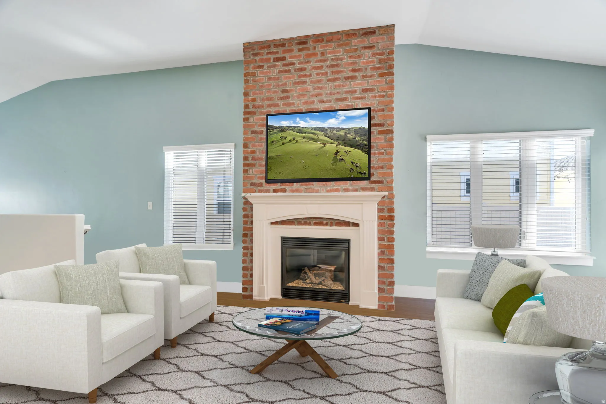 The heart of the home! This spacious great room combines comfortable living with timeless character, highlighted by the beautiful brick fireplace that buyers love.