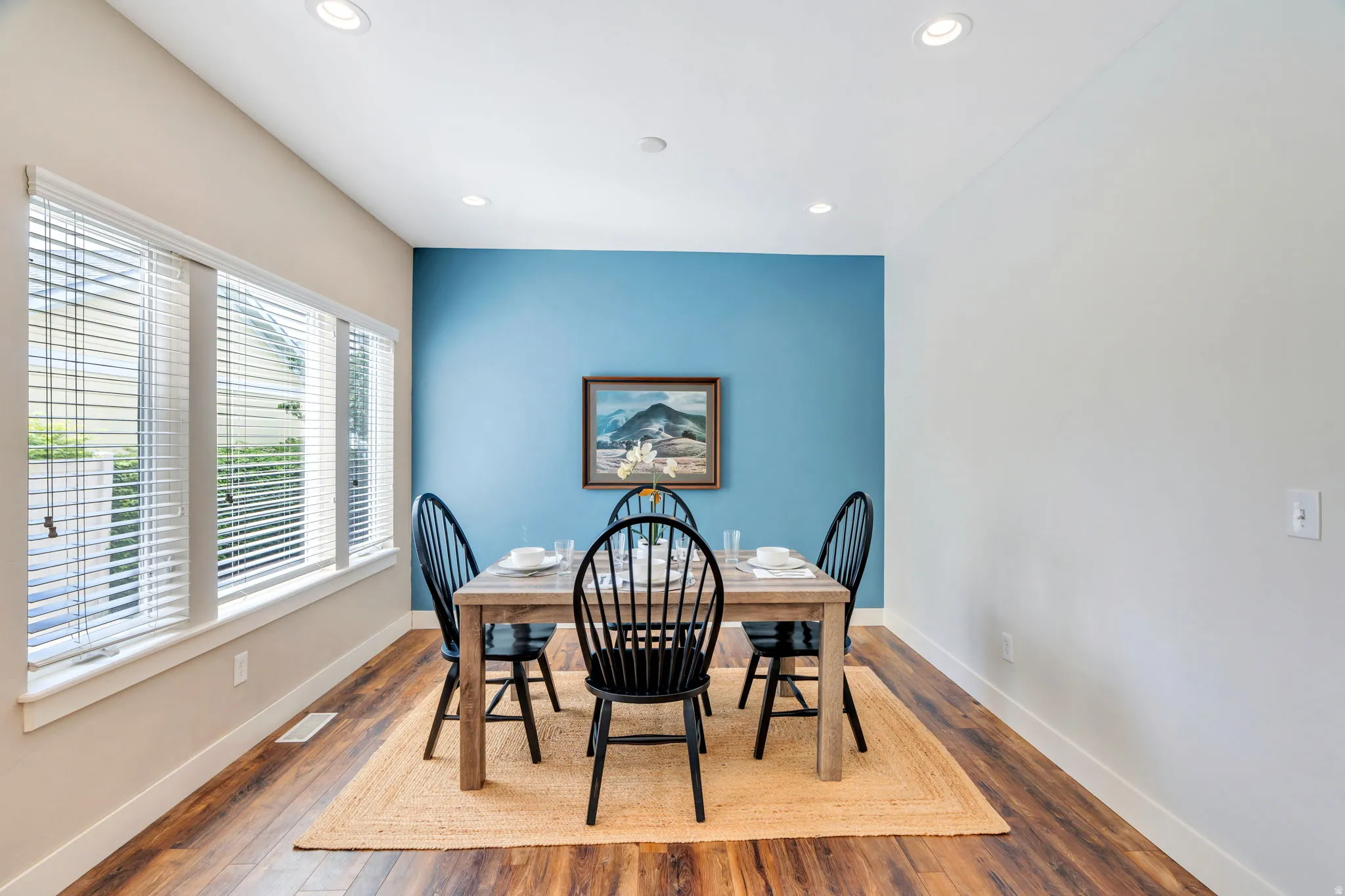 Cozy dining area filled with natural light, offering a comfortable space for casual dining while staying connected to the heart of the home.