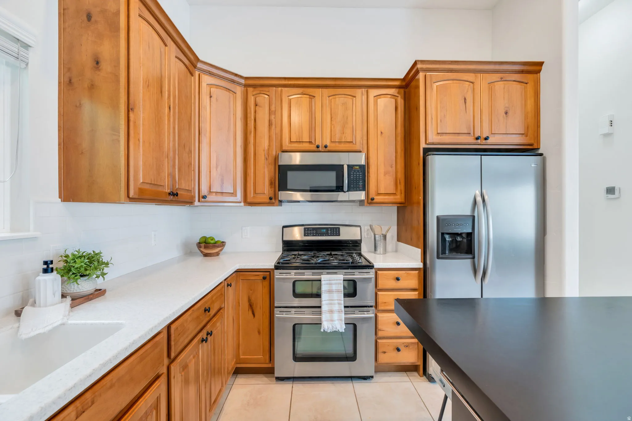 Efficiently designed kitchen offering everything you need while keeping you connected to family and guests in the adjoining living spaces.