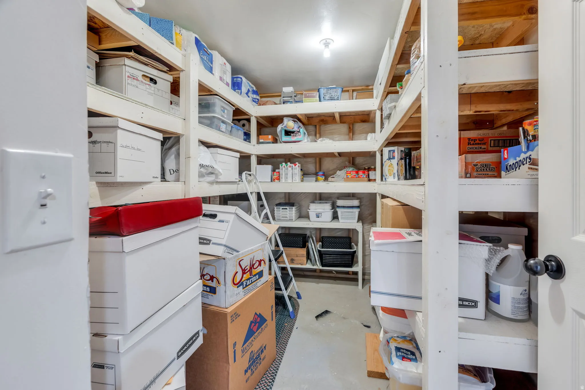 View of cold storage area with built-in shelves.