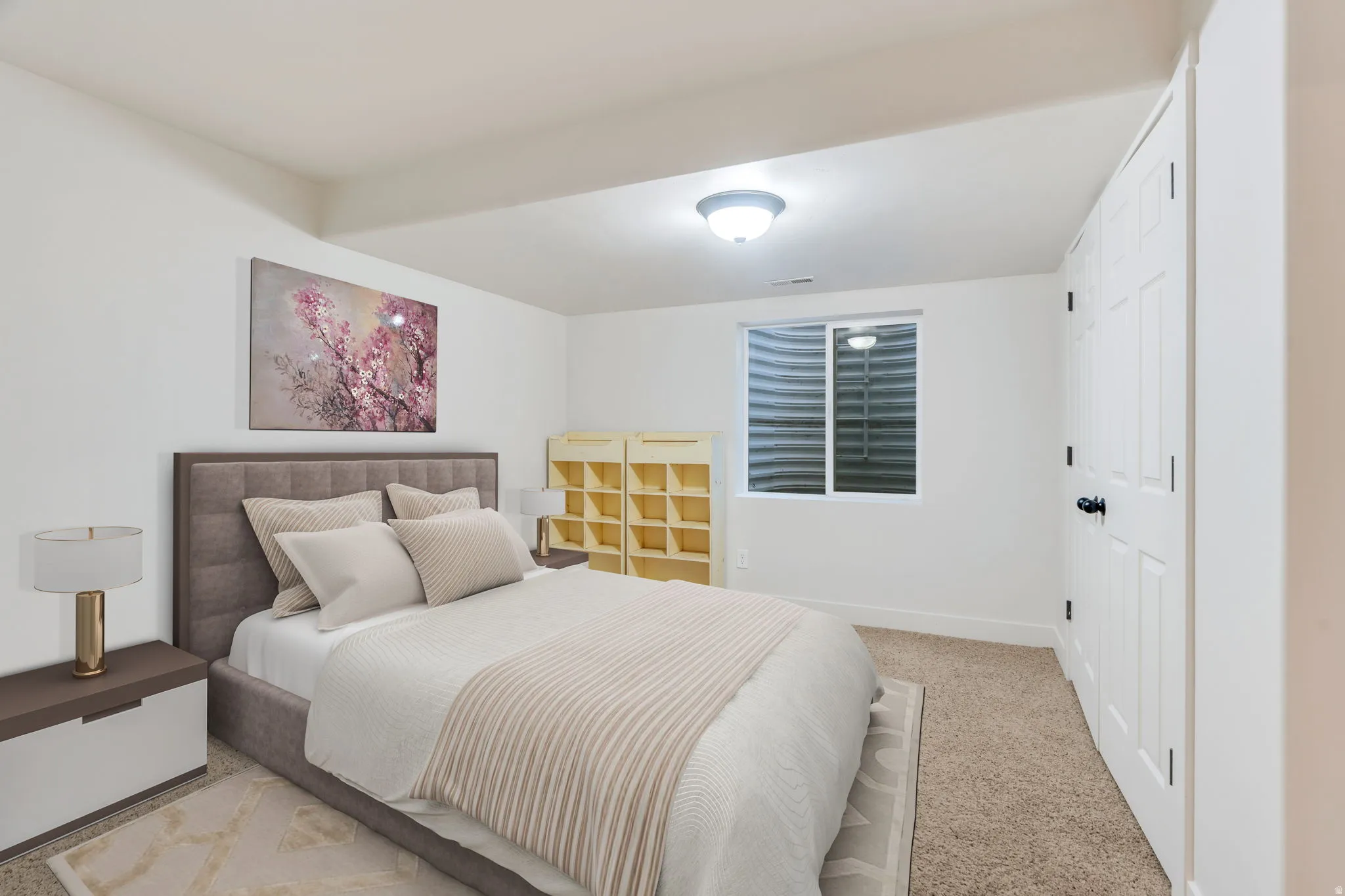 Private lower-level bedroom perfectly suited for multi-generational living, visiting family, or creating a quiet space away from the main living areas.