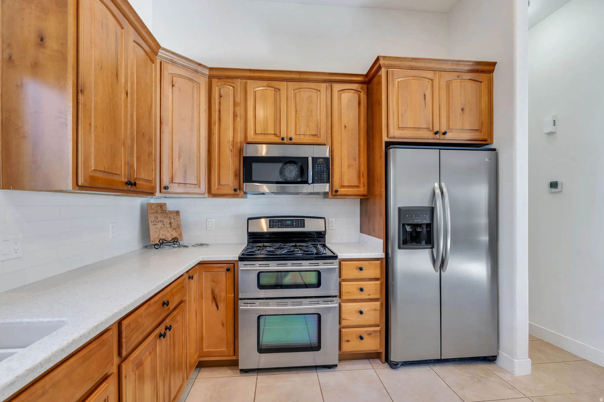 Stainless steel appliances including Refrigerator are included.