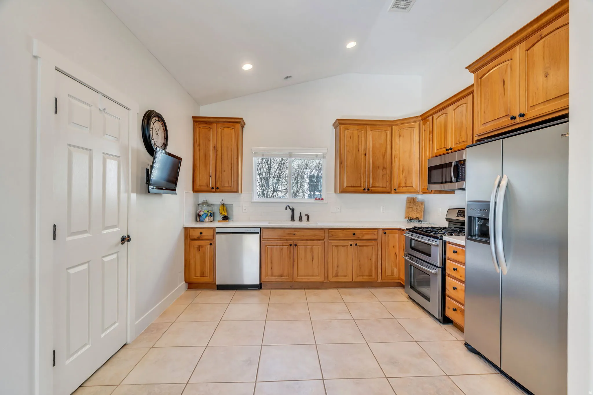 Functional kitchen with ample storage and easy access to the dining and living areas, creating a comfortable space for everyday living and entertaining.