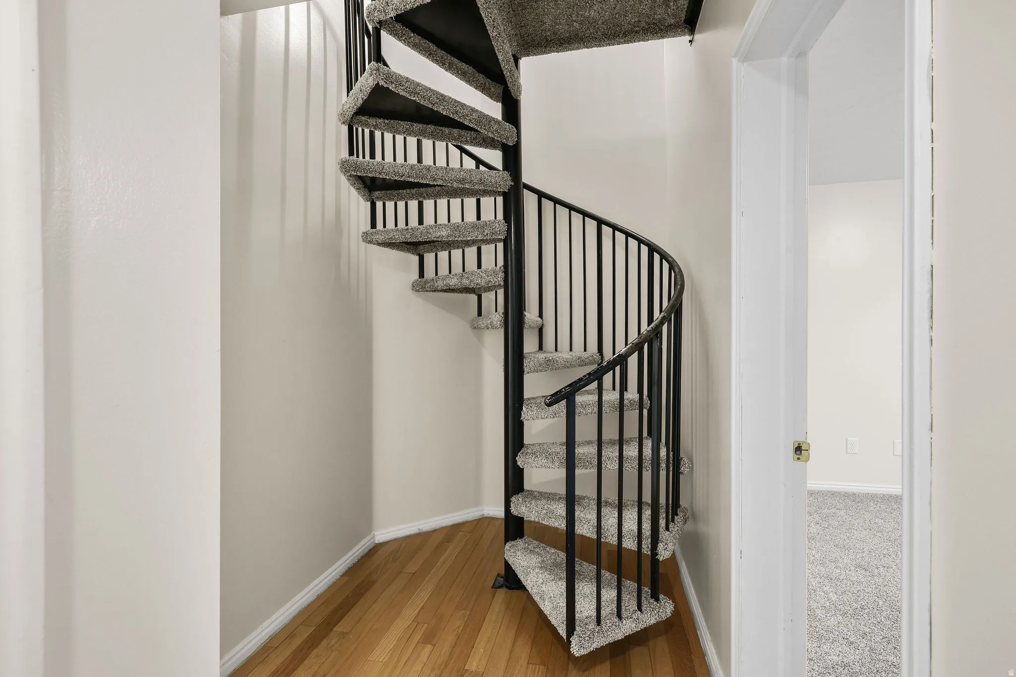 Staircase up to large master suite and office space