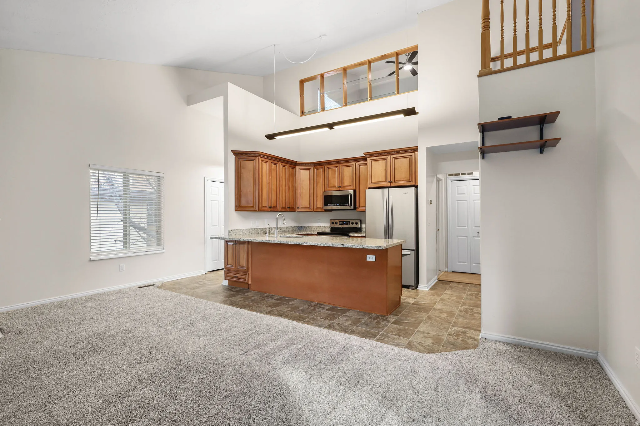 Open floor plan with new appliances, cabinetry and counter tops
