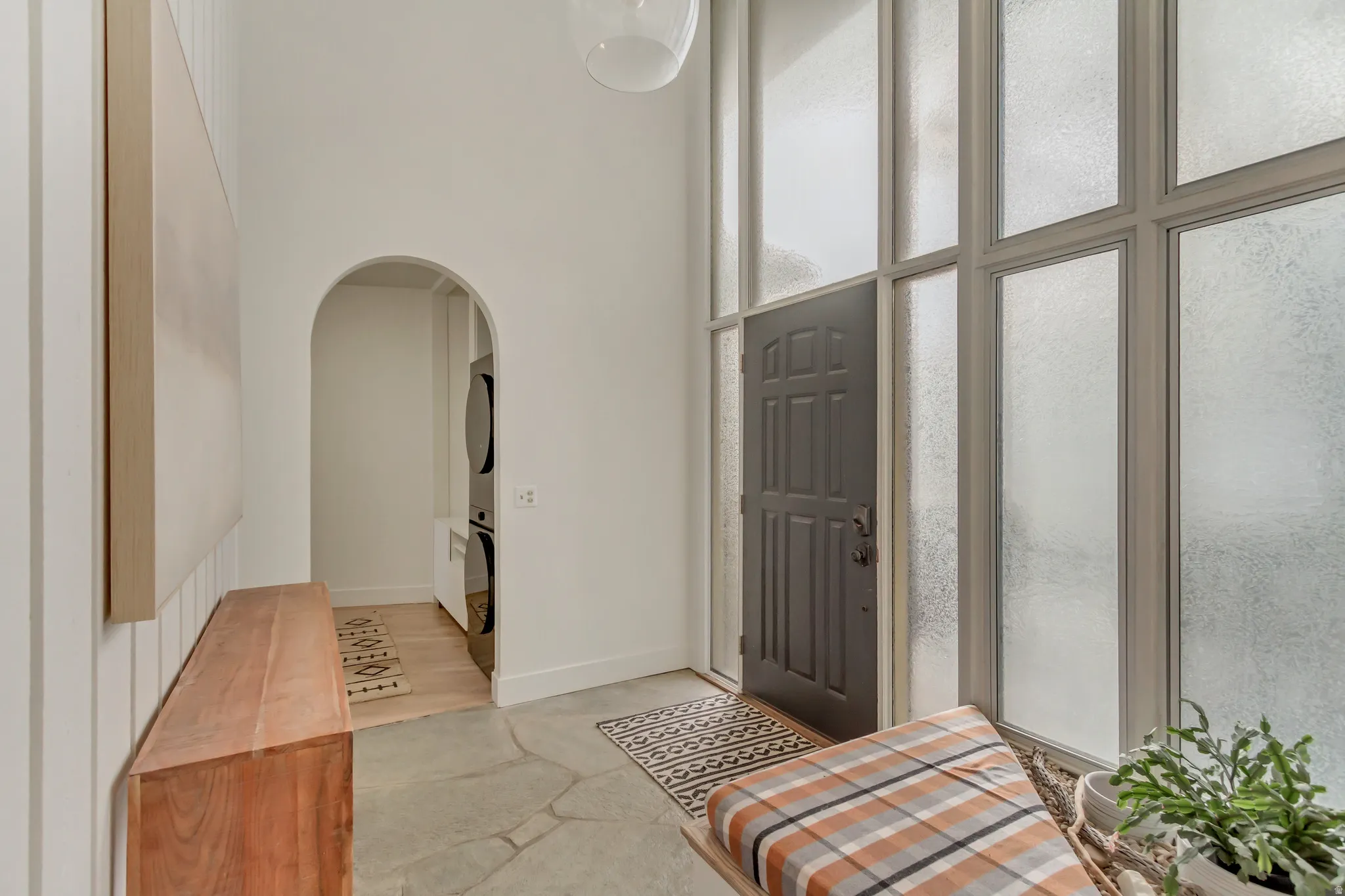 Entrance to property with stacked washer / dryer