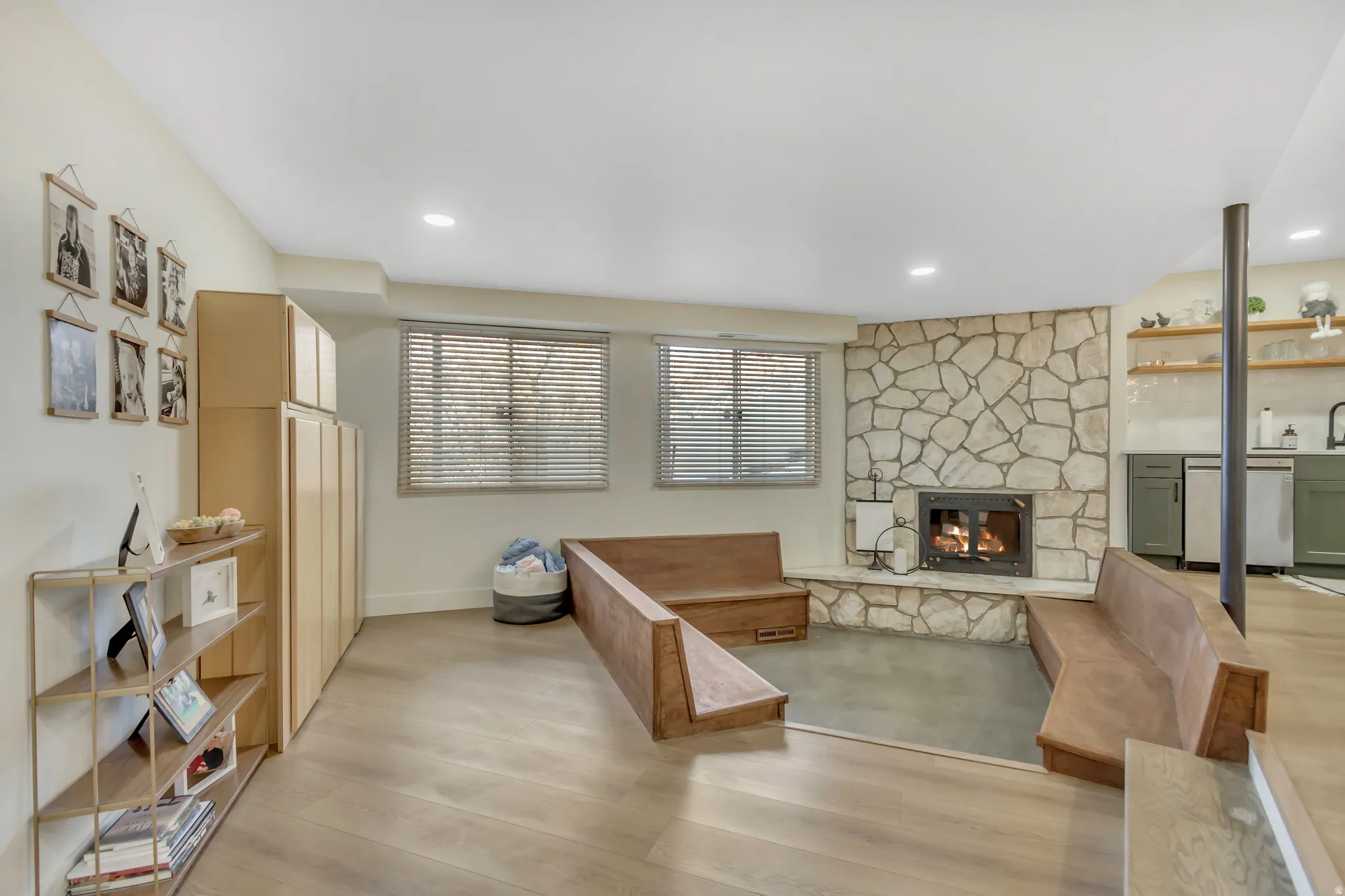 Living area featuring a fireplace and light wood-style flooring