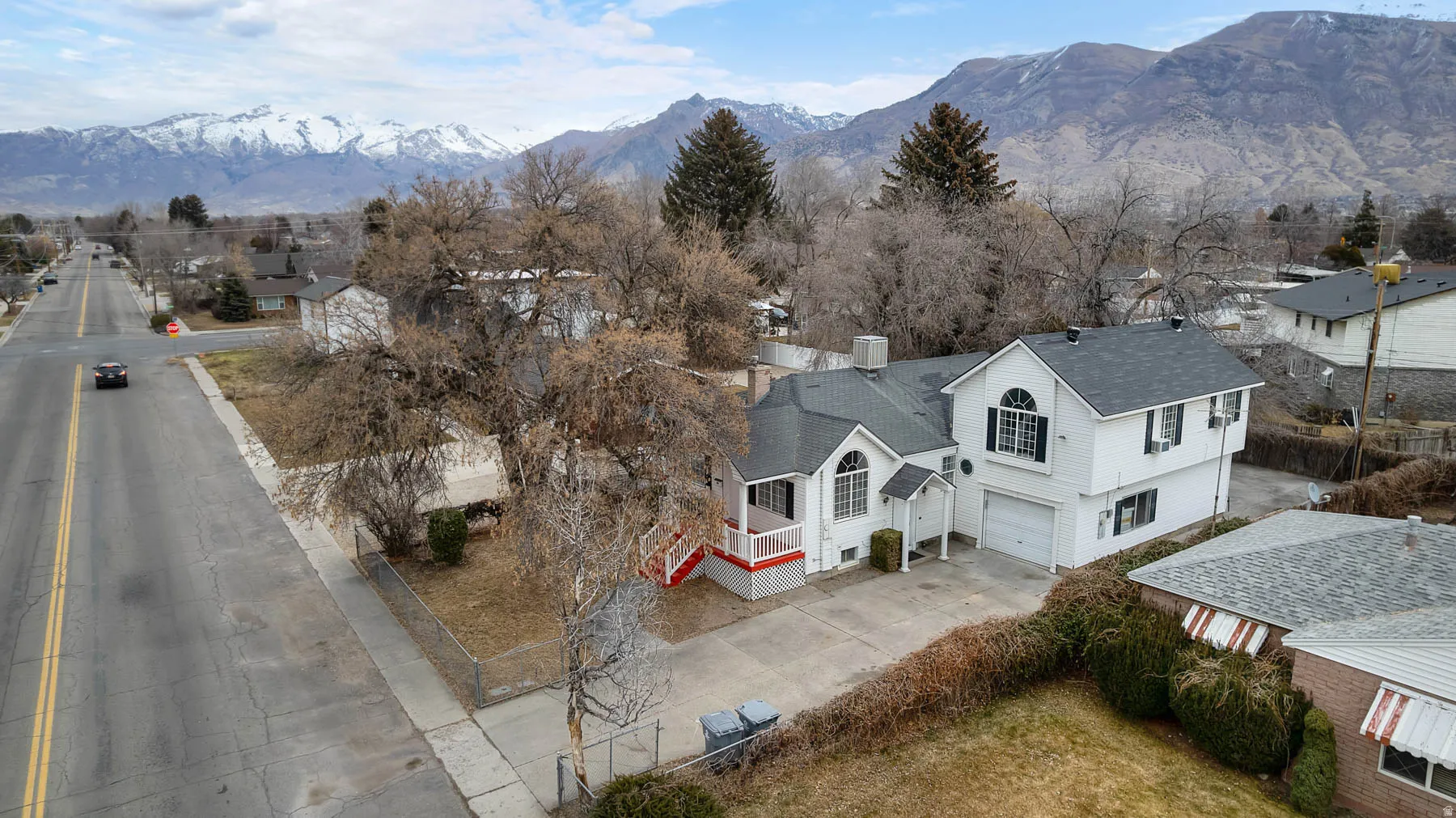 Aerial view of residential area featuring a mountainous background