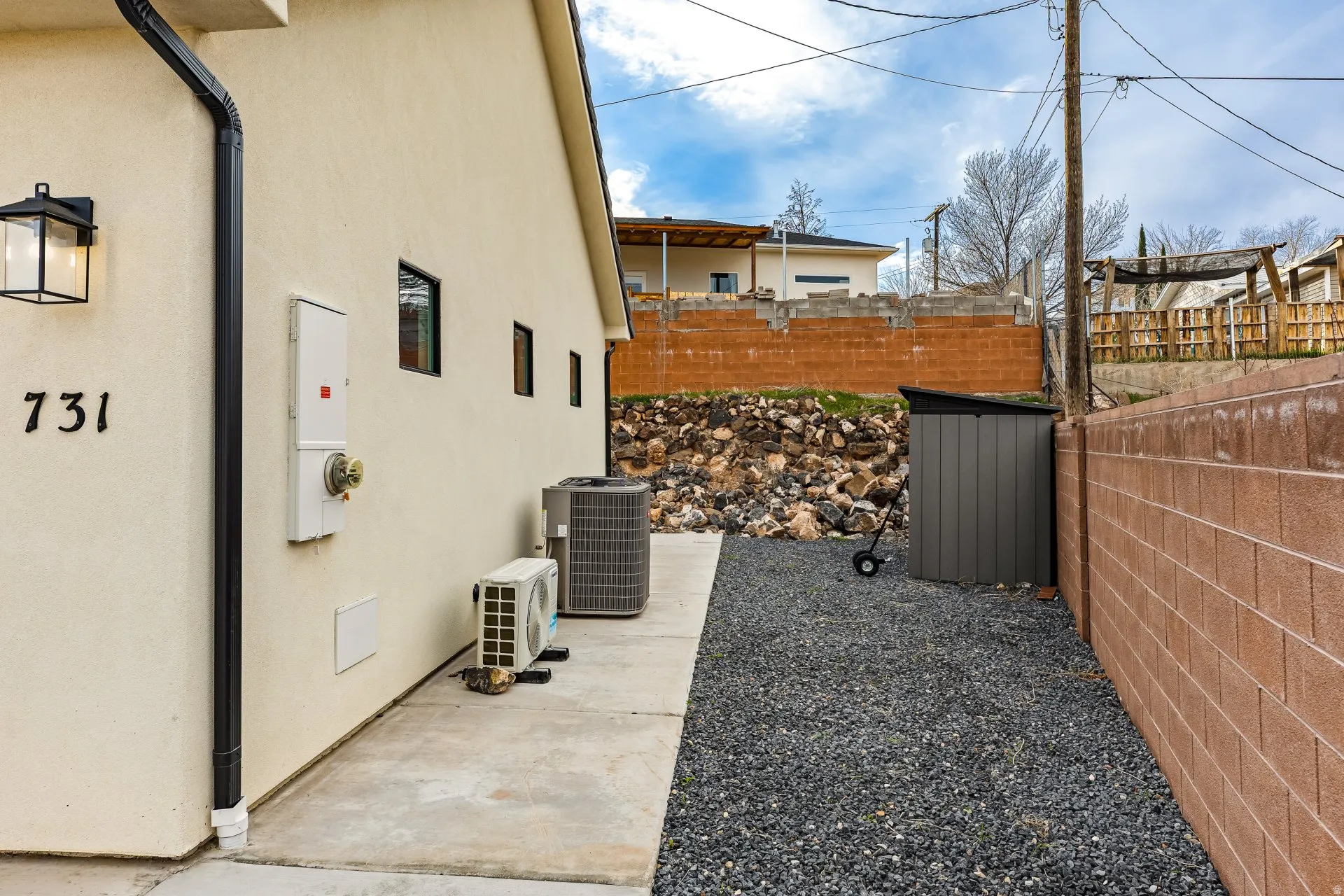 View of property exterior with an ac unit and stucco siding