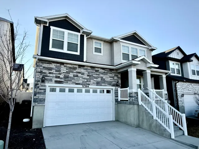 Craftsman house featuring stone siding, a garage, a porch, concrete driveway, and stucco siding