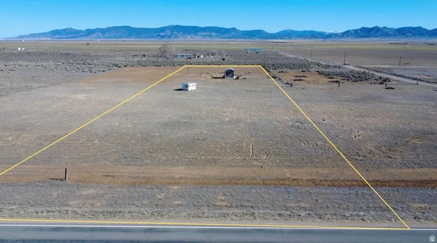 Aerial view of sparsely populated area with a mountain backdrop