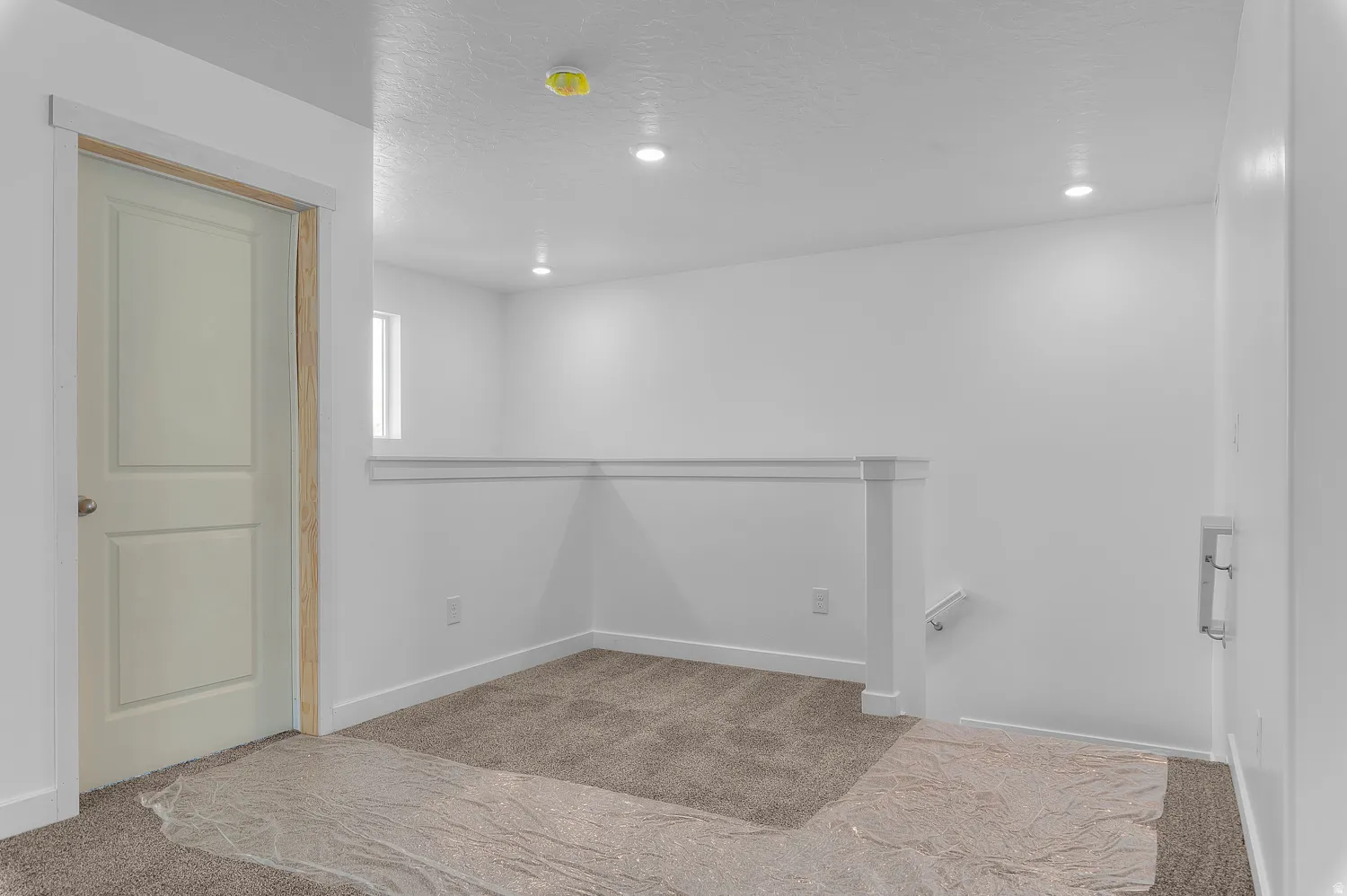 Below grade area featuring carpet flooring and recessed lighting