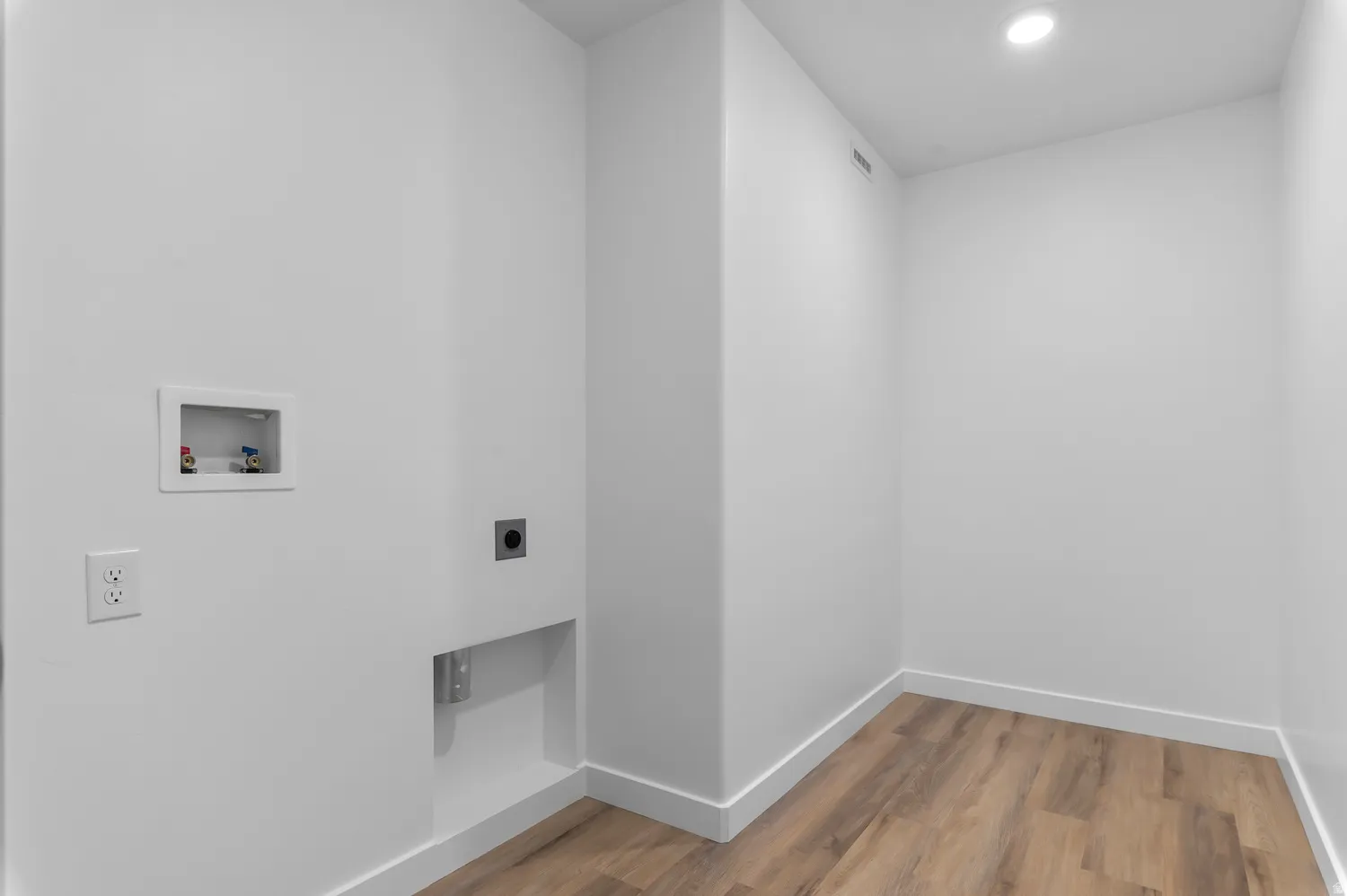 Laundry area featuring light wood-style floors, recessed lighting, hookup for an electric dryer, and hookup for a washing machine
