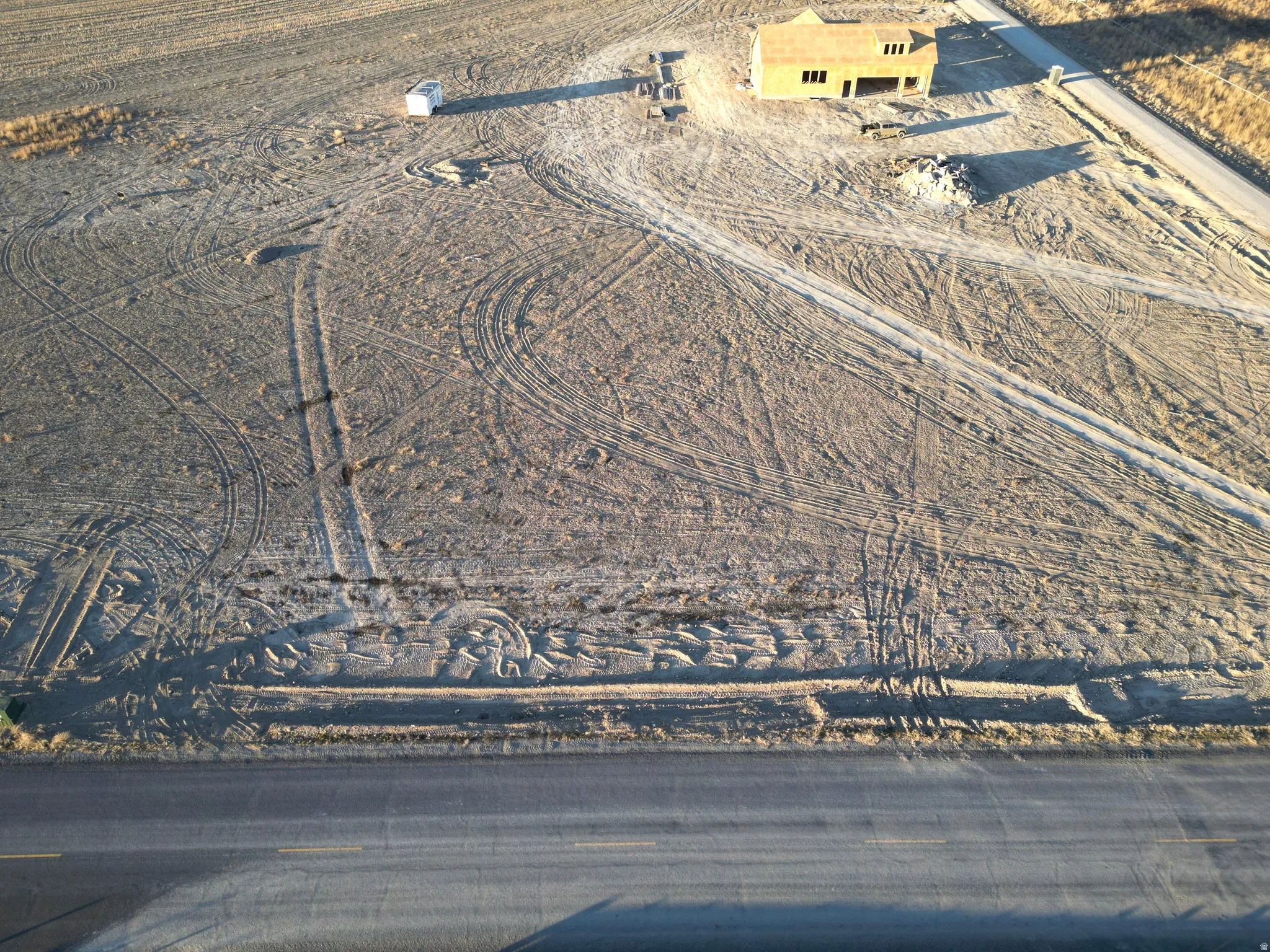 Aerial view of property and surrounding area featuring rural landscape