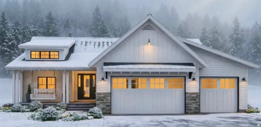 Modern inspired farmhouse featuring stone siding, covered porch, driveway, and a garage