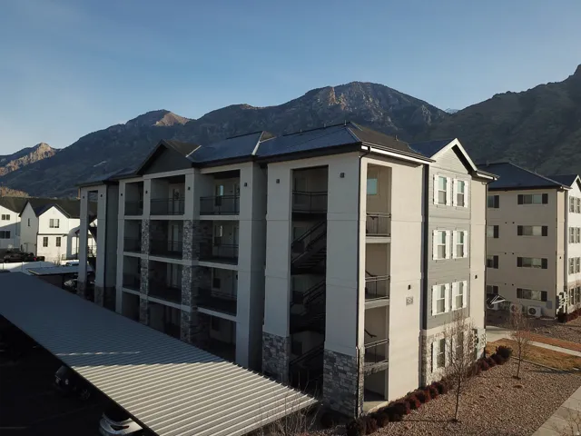 View of home's exterior featuring a mountain view and stone siding