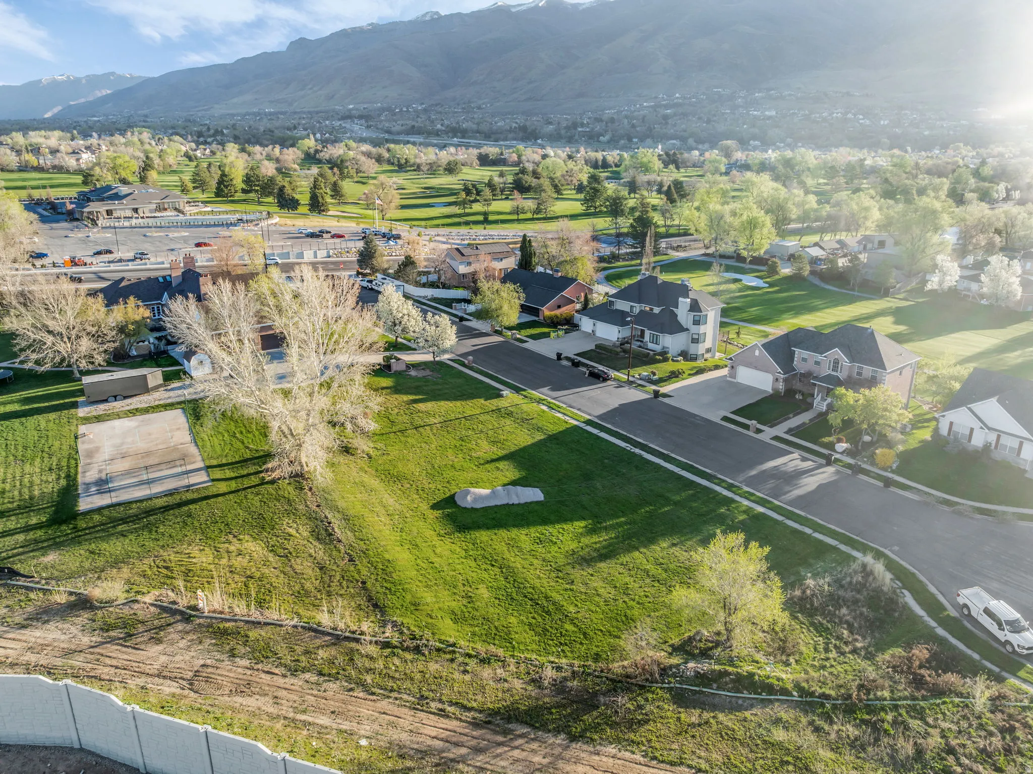 Aerial perspective of suburban area featuring a mountainous background