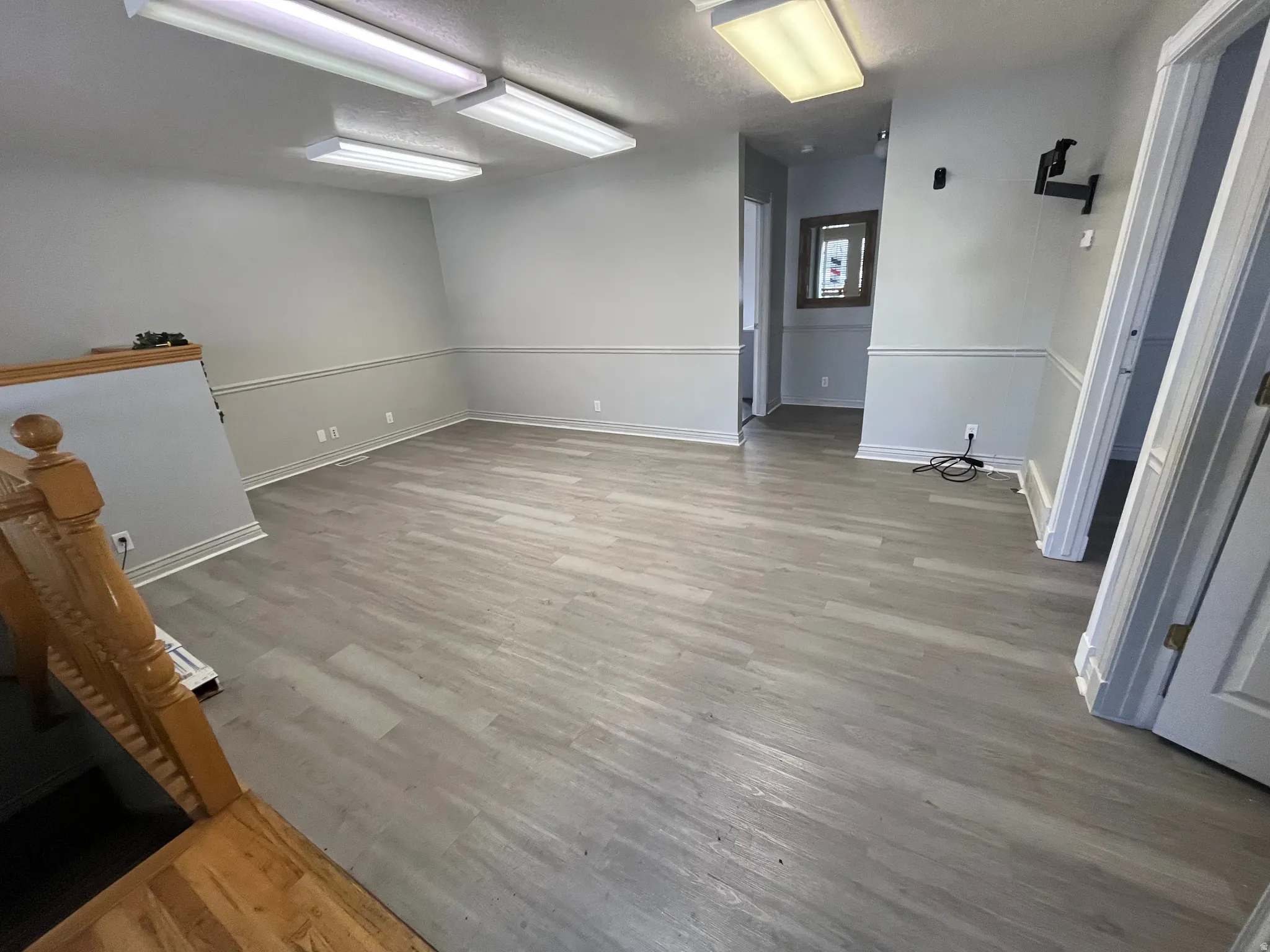 Empty room featuring light wood-style floors and baseboards