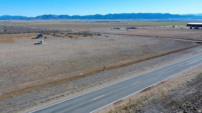 Aerial view of sparsely populated area featuring a mountainous background