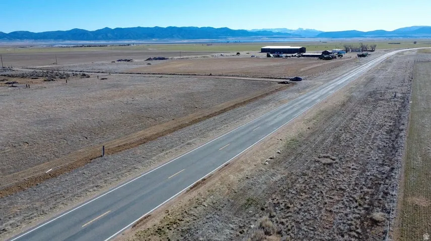 Aerial view of sparsely populated area with a mountain backdrop