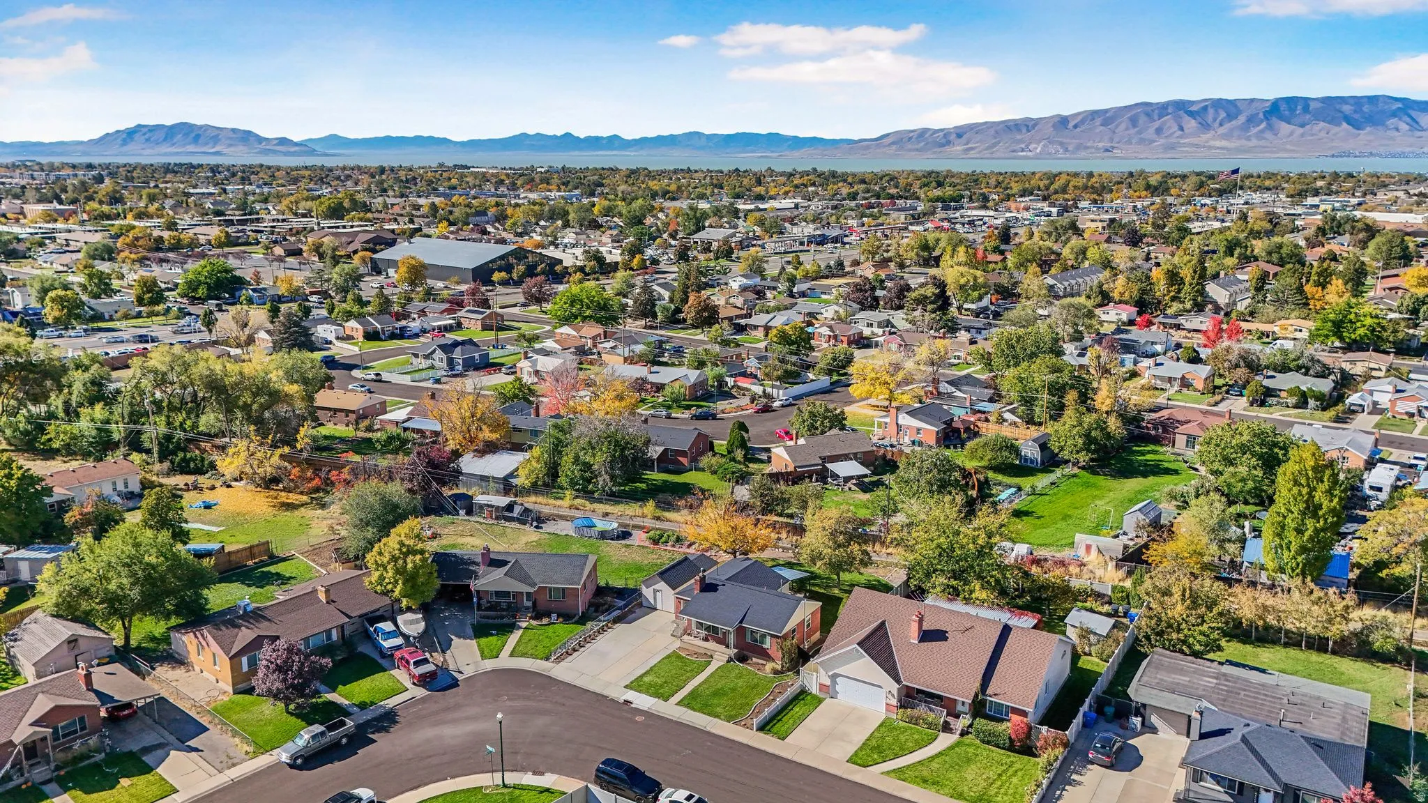 Aerial view of residential area featuring a mountainous background