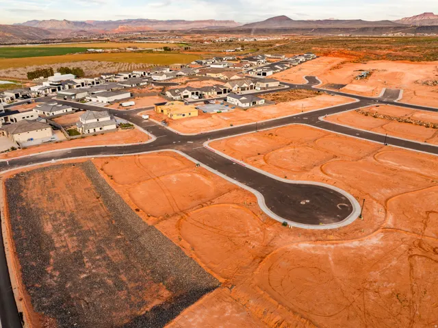 Aerial view of residential area featuring a mountain backdrop