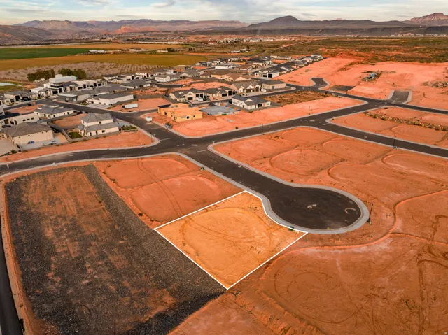 Aerial perspective of suburban area featuring a mountainous background