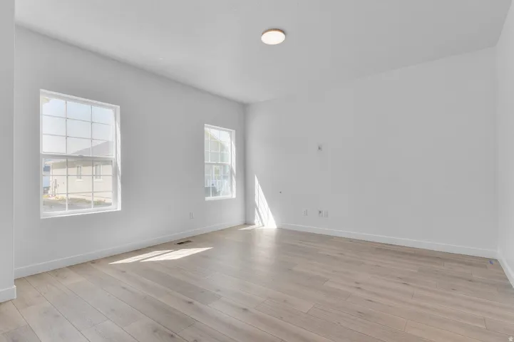 Spare room with light wood-style flooring