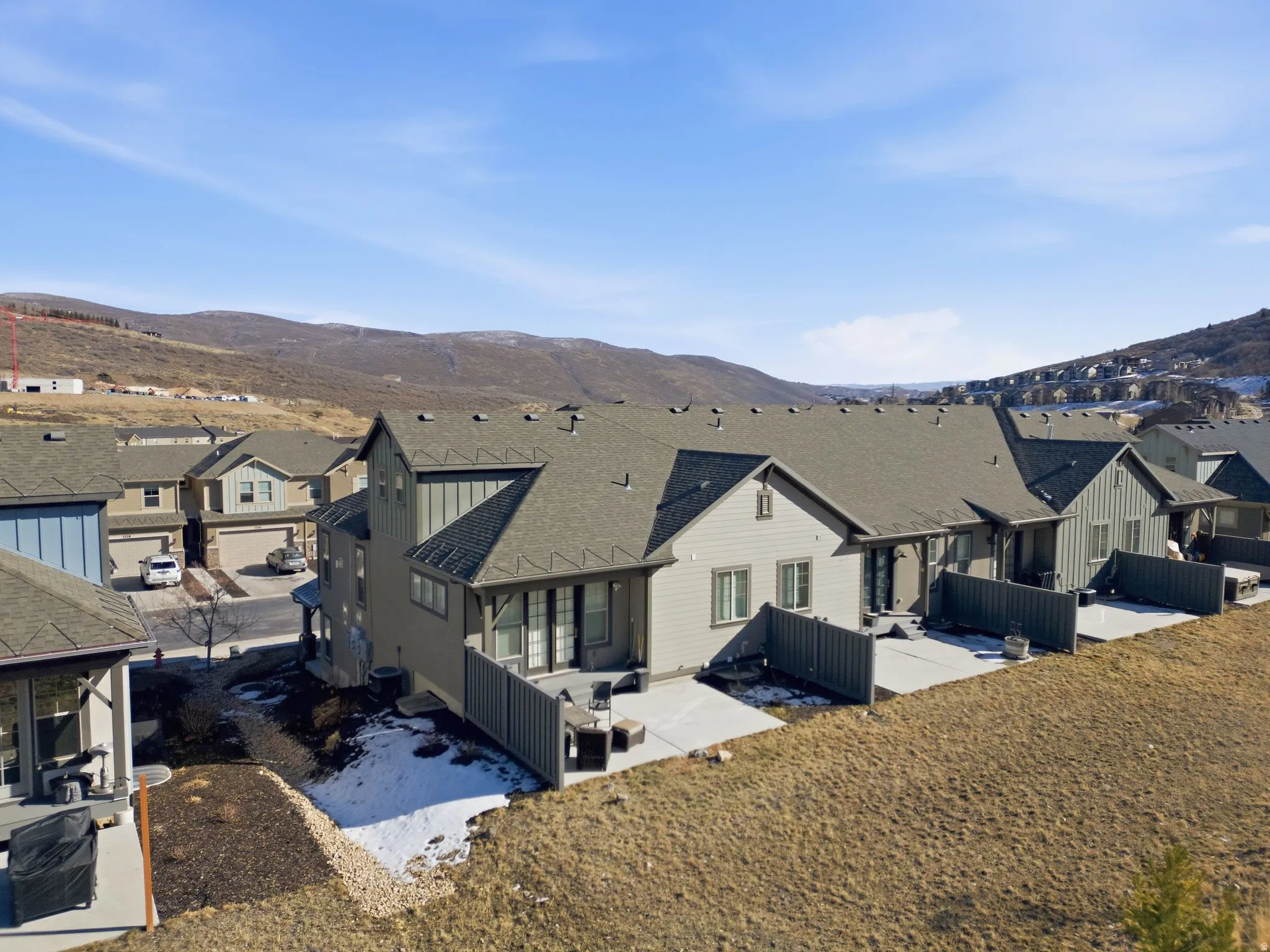 Aerial view of residential area featuring a mountainous background