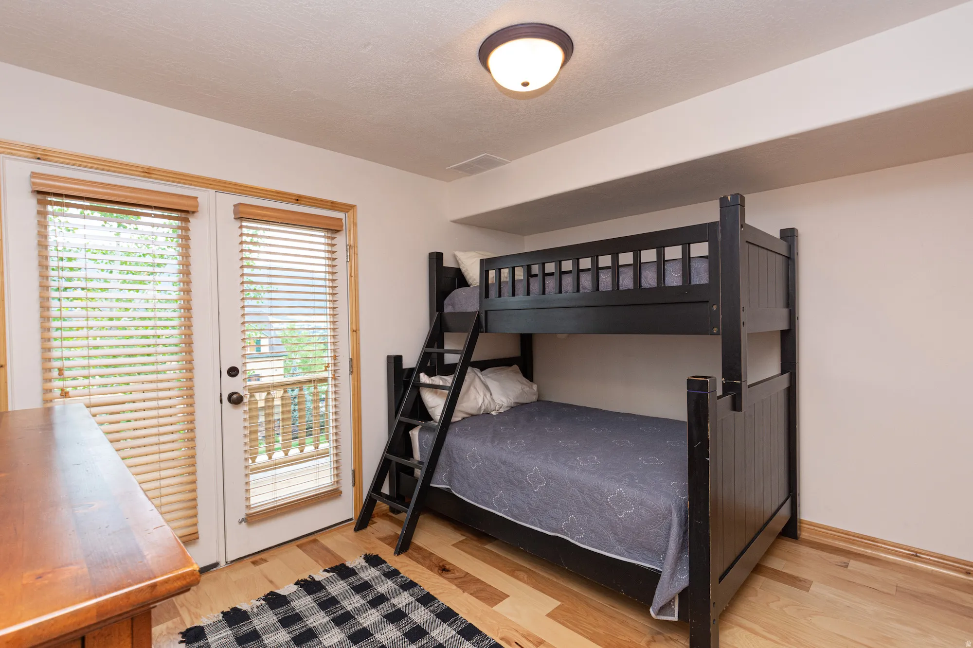 Main level bedroom - furniture is currently removed and tenants are using as an office.