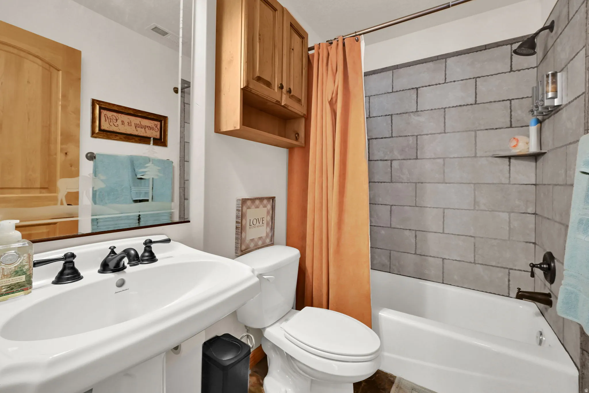 Full bathroom featuring shower / tub combo with curtain and toilet