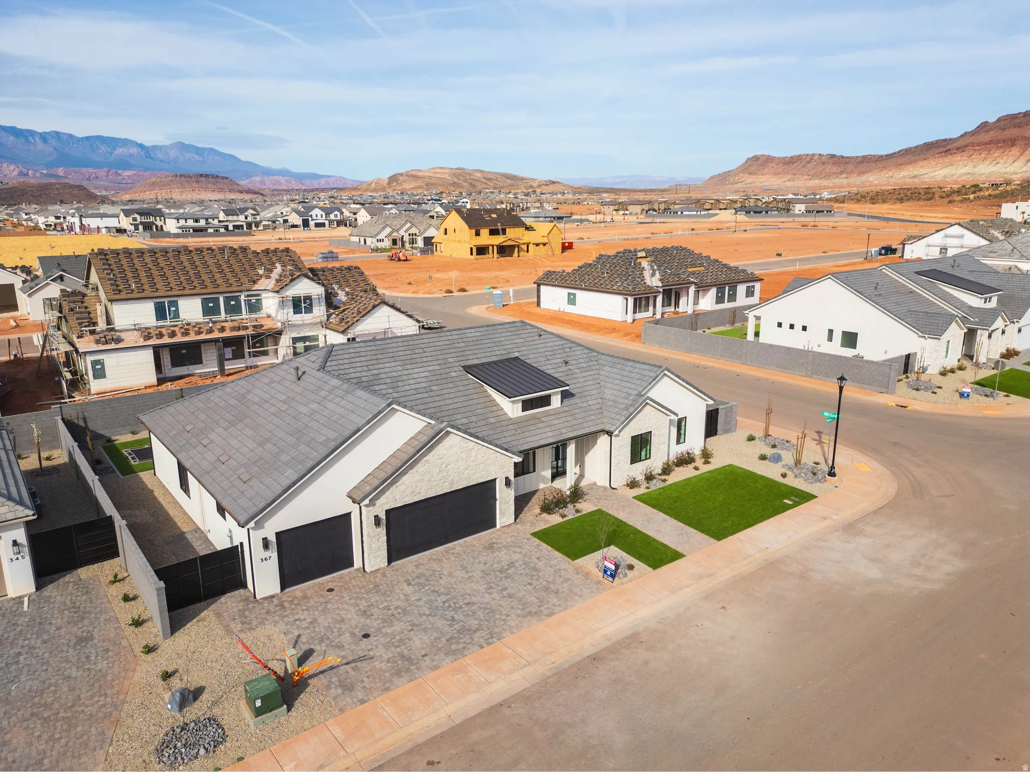 Aerial view of residential area featuring mountains