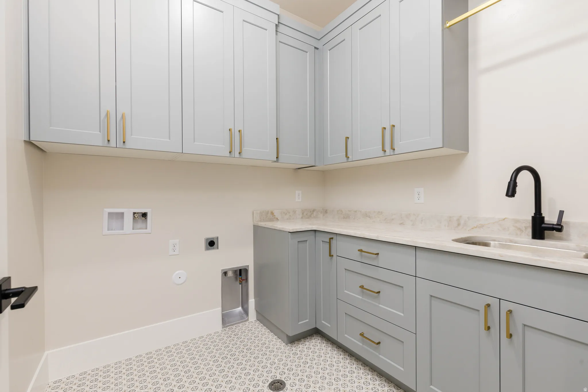 Laundry room featuring hookup for a gas dryer, hookup for a washing machine, electric dryer hookup, and cabinet space
