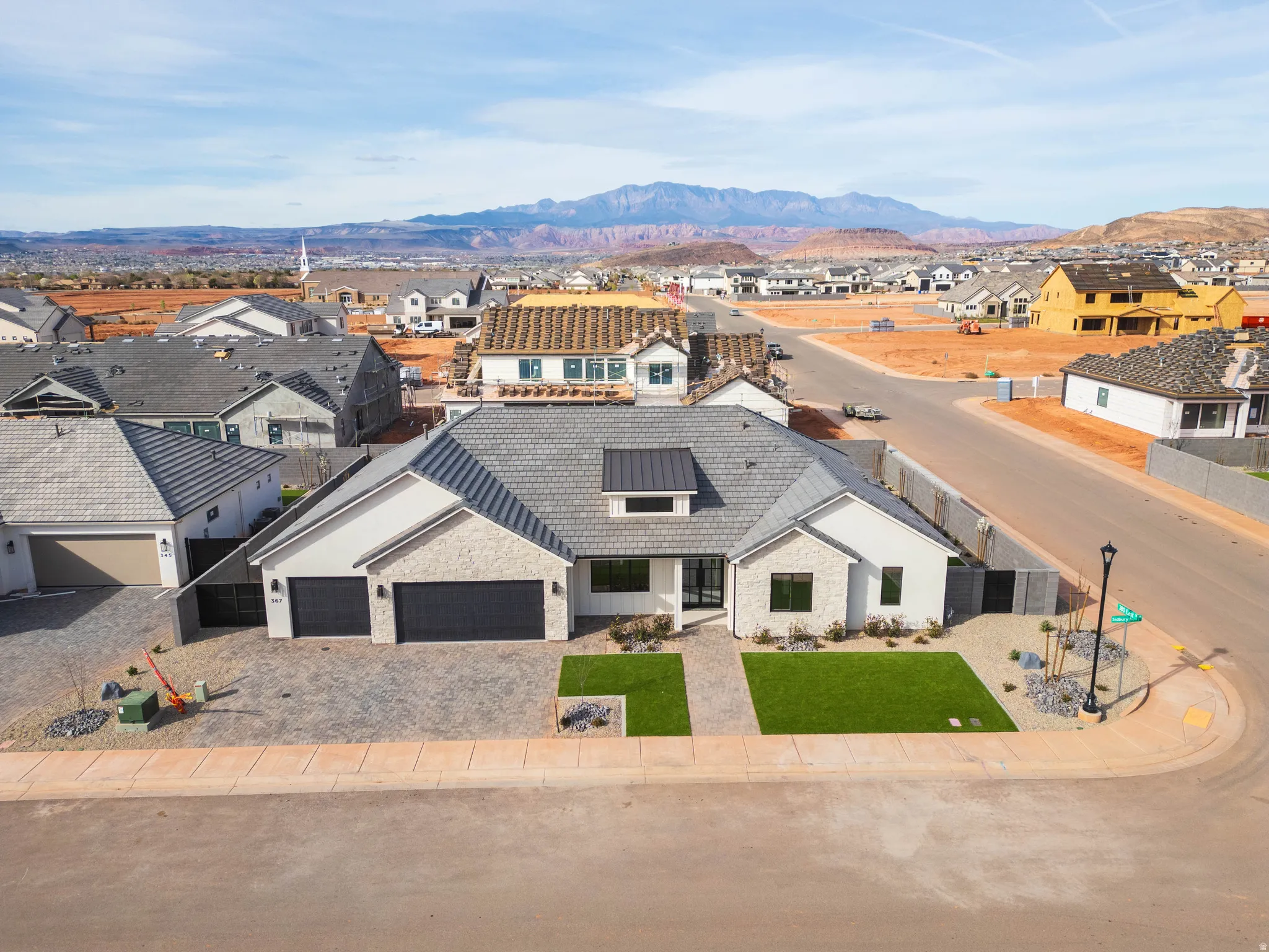 Aerial view of residential area with a mountainous background