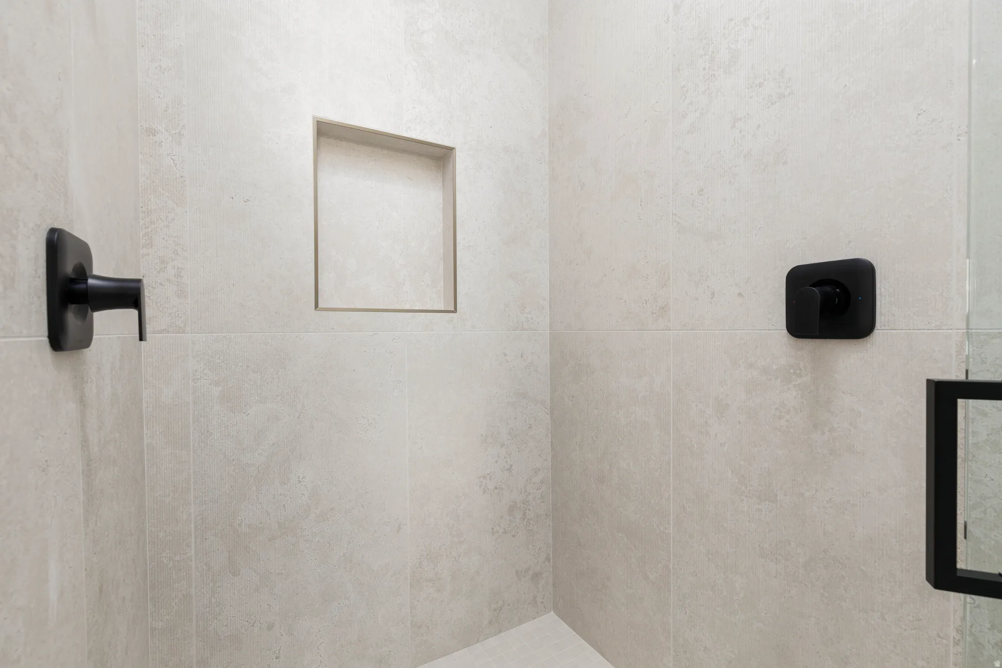 Bathroom featuring a tile shower