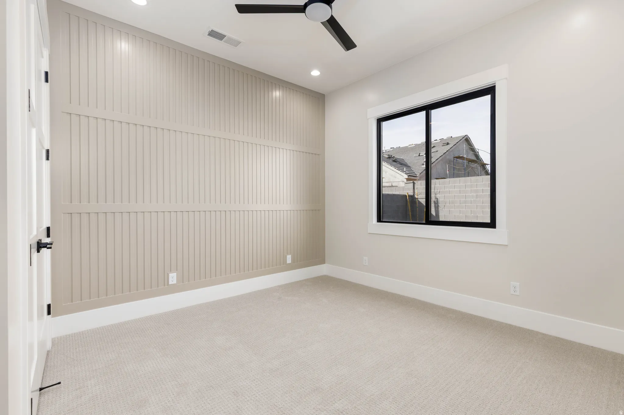 Spare room with light carpet, a ceiling fan, and recessed lighting