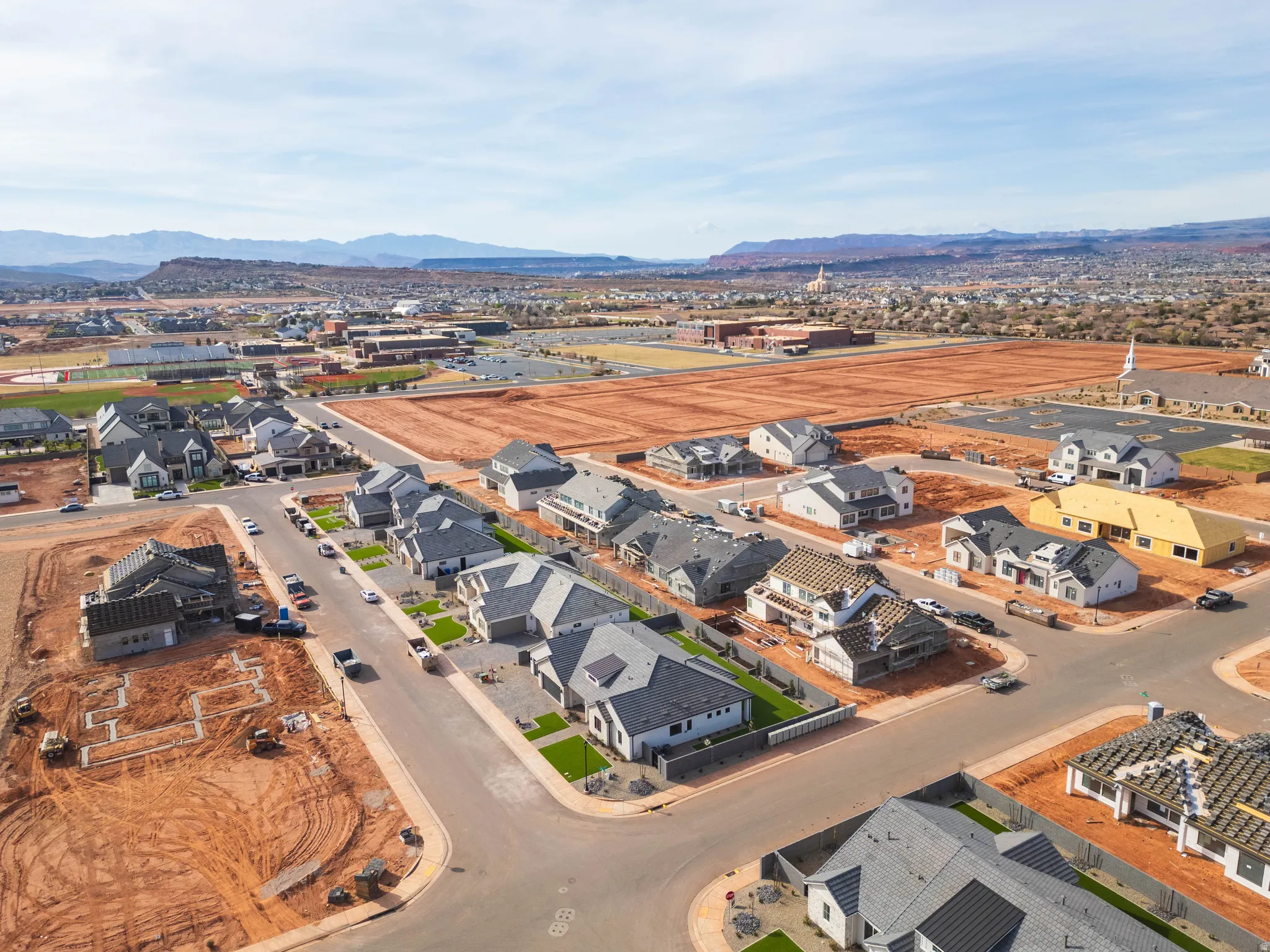 Aerial view of property's location featuring mountains and nearby suburban area